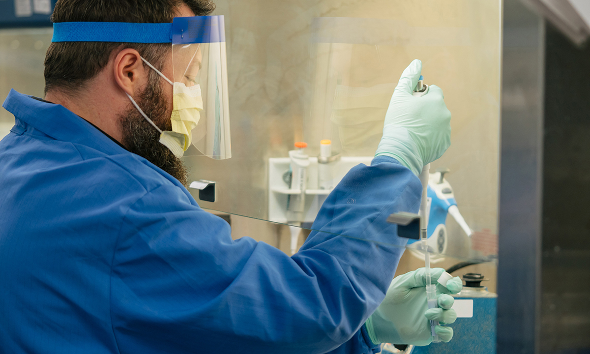 Lab worker wearing PPE